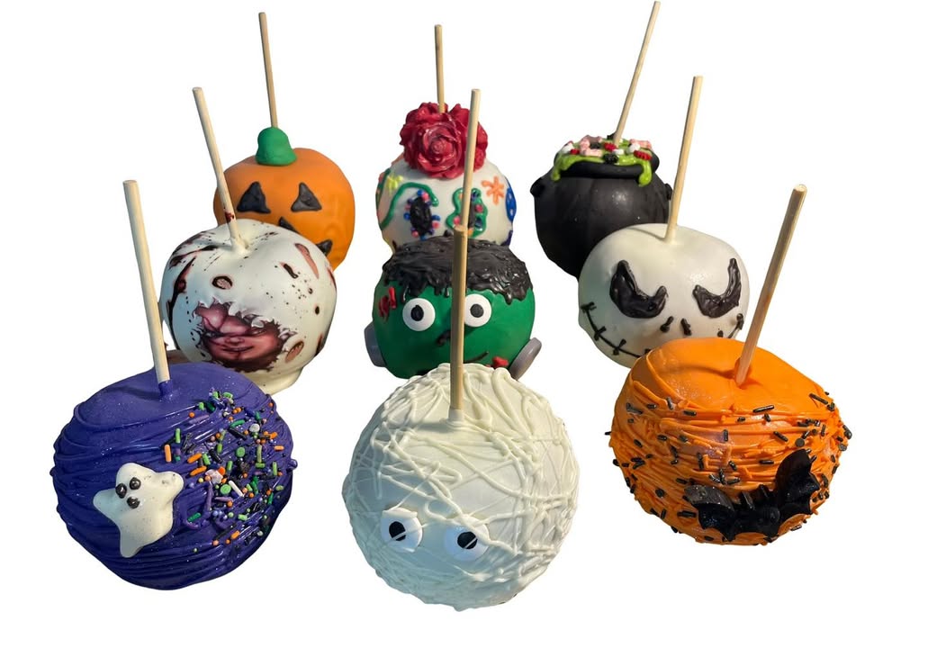 Caramel Halloween apples decorated as pumpkins, mummies, monsters, and ghosts